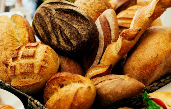 bunch of bread loafs on the table