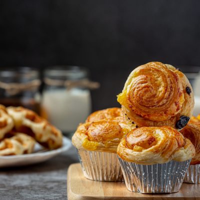 Fresh Danish bread with milk and fruit, blueberry, cherry sauce served with milk.
